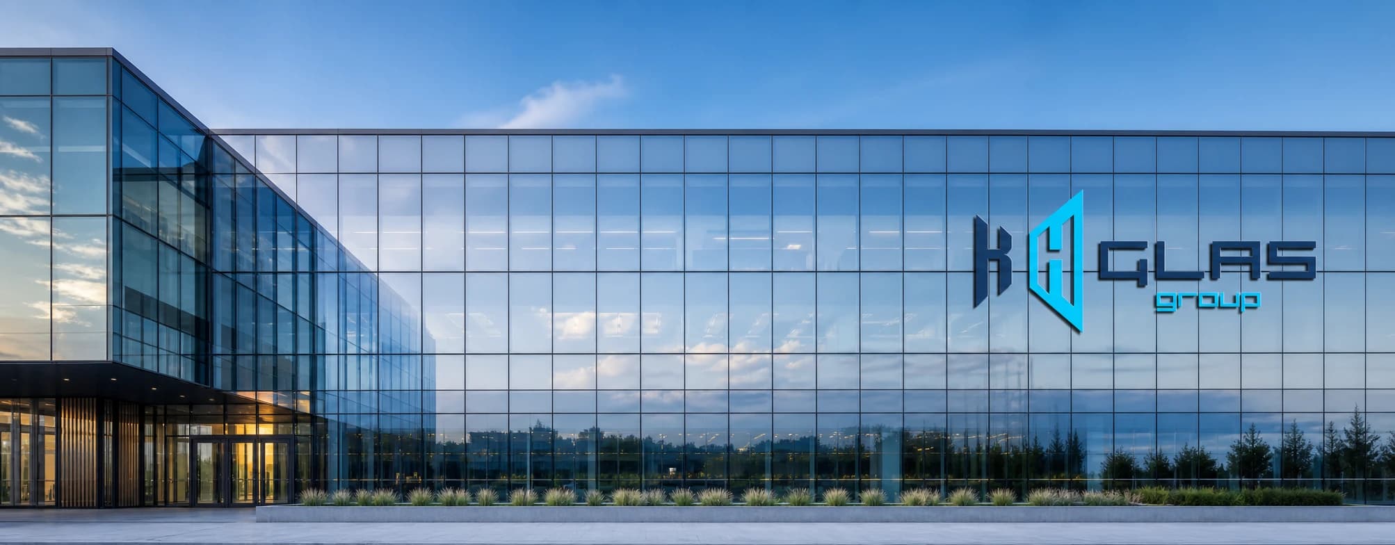 KH Glass Group identity mounted on a modern architectural glass facade